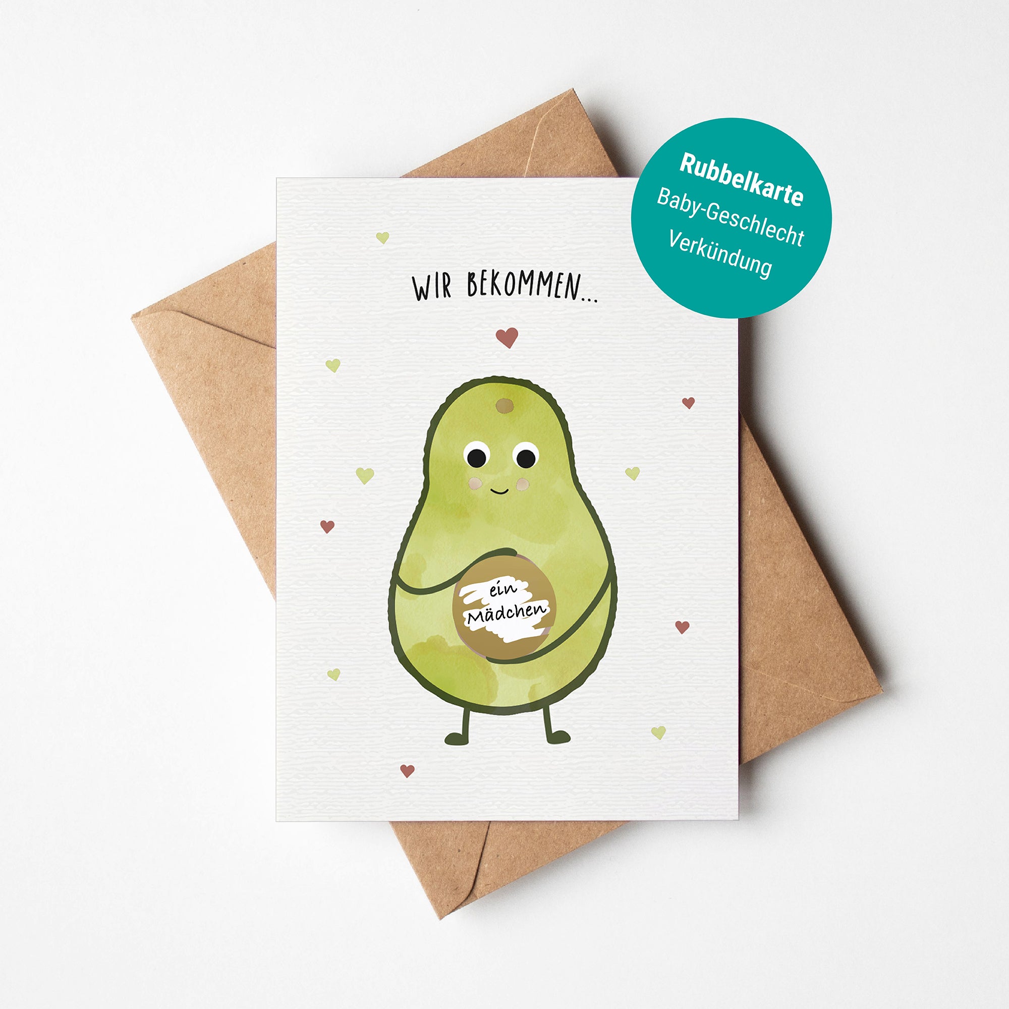 Illustration einer Rubbelkarte mit einer Avocado, die das Babygeschlecht verkündet, und dem Text „Es wird ein ...“ auf hellem Hintergrund