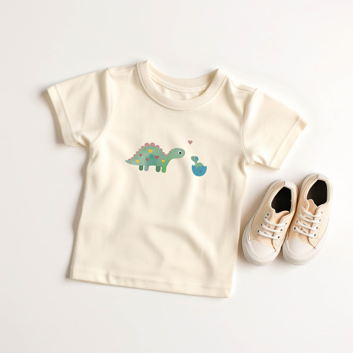 Bügelbild mit Dino-Mama und Baby im niedlichen Design, ideal zum Aufbügeln auf Kinderkleidung und Accessoires.
