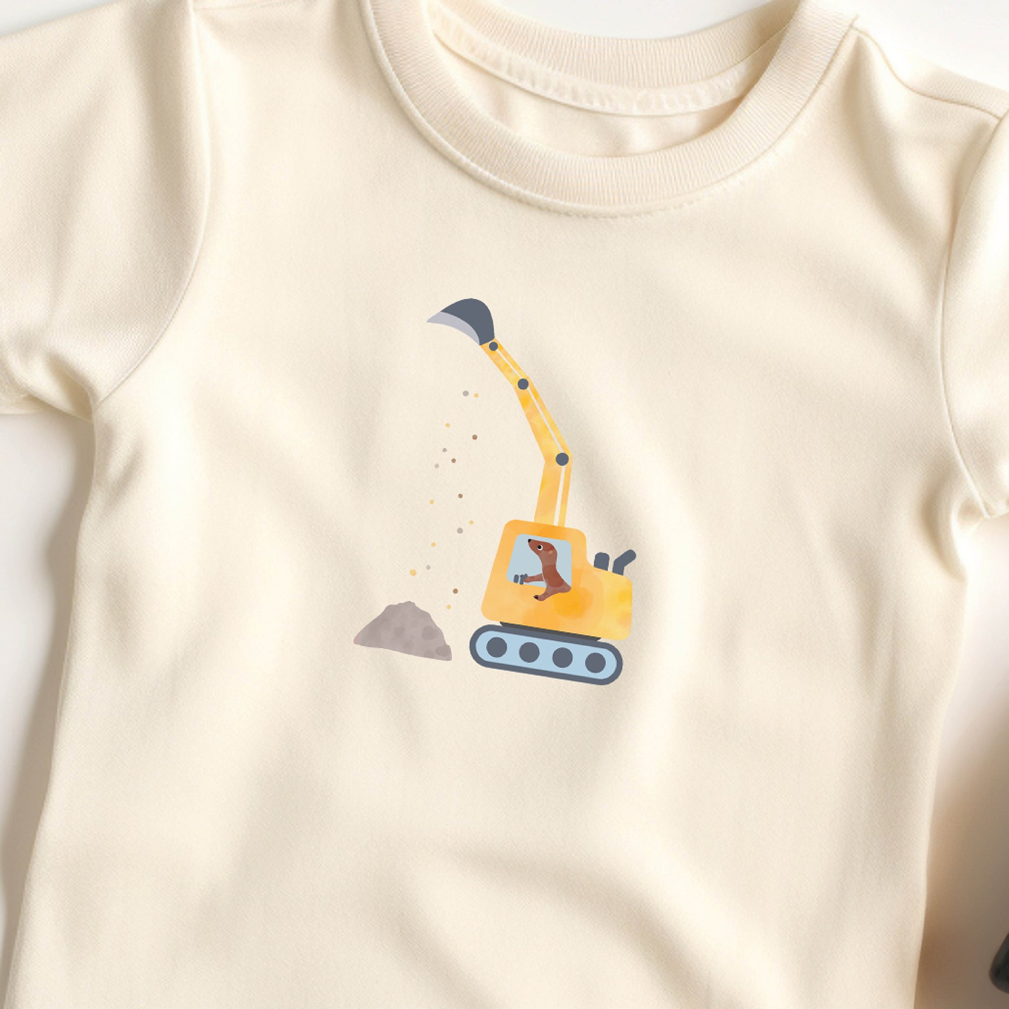 Bügelbild mit gelbem Bagger im kindlichen Design, perfekt zum Aufbügeln auf Kleidung, Taschen und Accessoires.