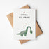 Postkarte mit Dinosaurier und dem Schriftzug „Kopf hoch, alles wird gut“ im niedlichen Design, ideal als Aufmunterungskarte.