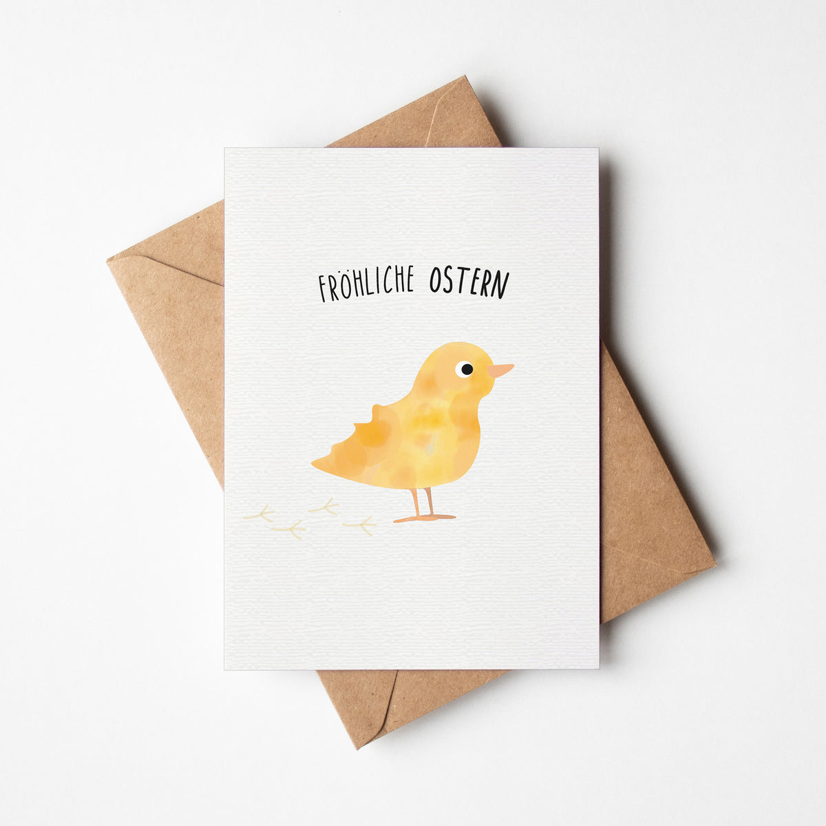 Postkarte mit Küken und dem Schriftzug „Fröhliche Ostern“ im niedlichen Design, ideal als Ostergruß oder Dekoration.