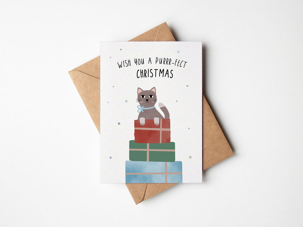 Postkarte mit Katze und Weihnachtsmütze sowie dem Schriftzug „Purrrfect Christmas“ im niedlichen Design, ideal als Weihnachtskarte oder kleiner Gruß.