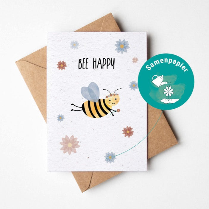 Samenpapierkarte mit bunten Blumen und einer niedlichen Biene mit Blumenkranz