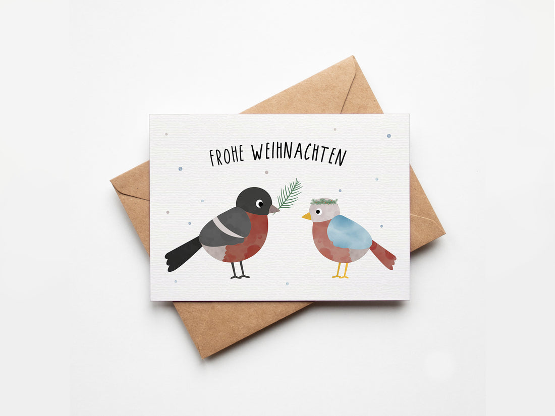 Postkarte mit Wintervogel auf einem Zweig und dem Schriftzug „Frohe Weihnachten“ im zarten Design, ideal als Weihnachtskarte oder kleiner Gruß.